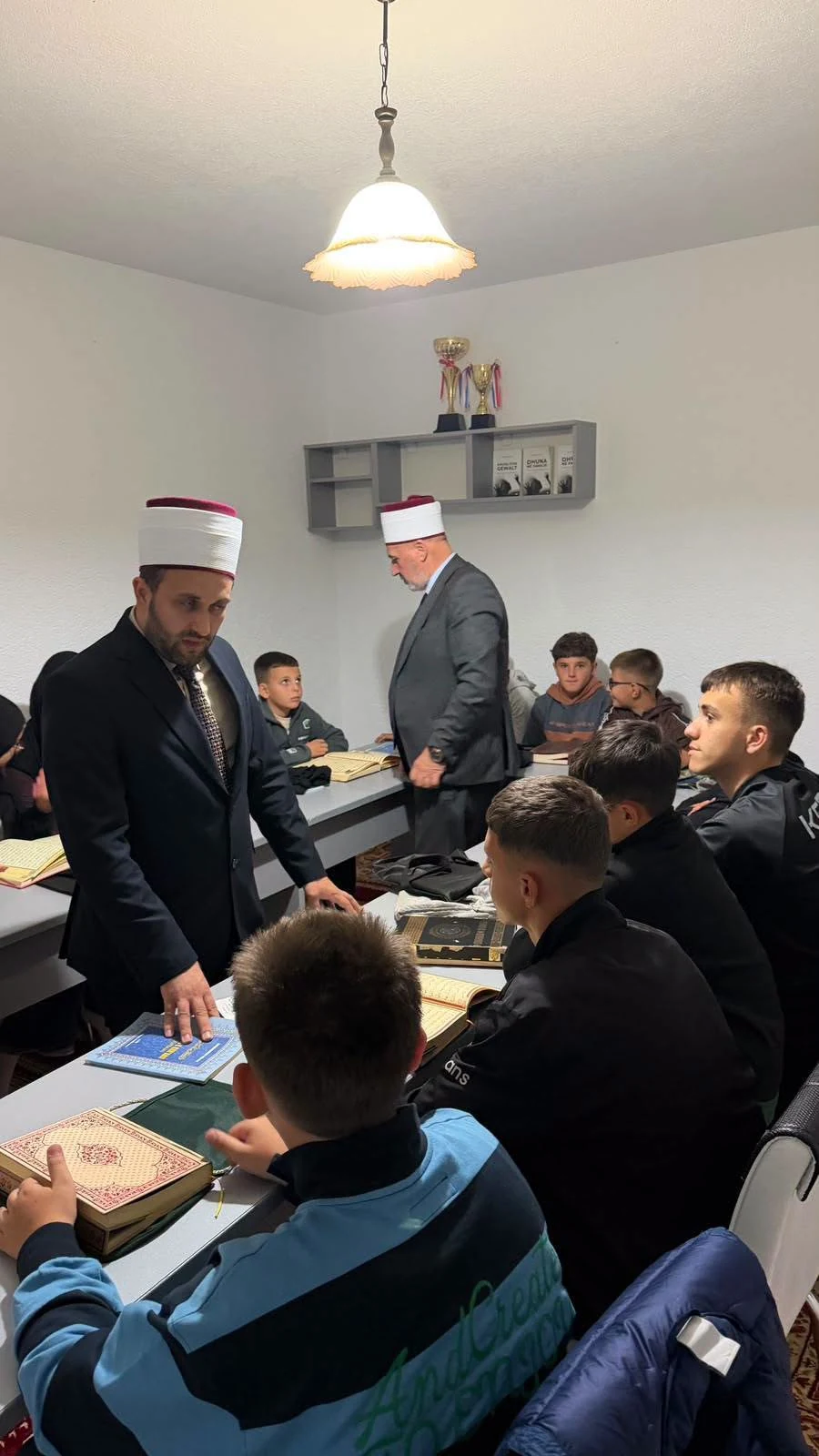 Students at the New Mosque in Pallçisht i Poshtëm pass their Qur’an examination