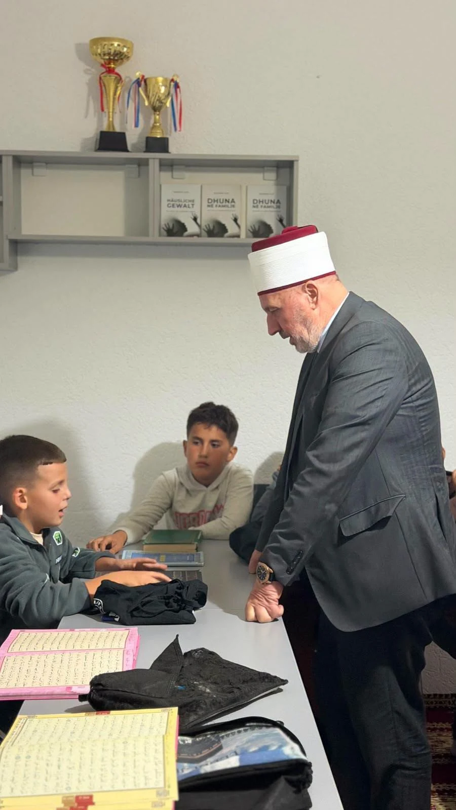 Students at the New Mosque in Pallçisht i Poshtëm pass their Qur’an examination